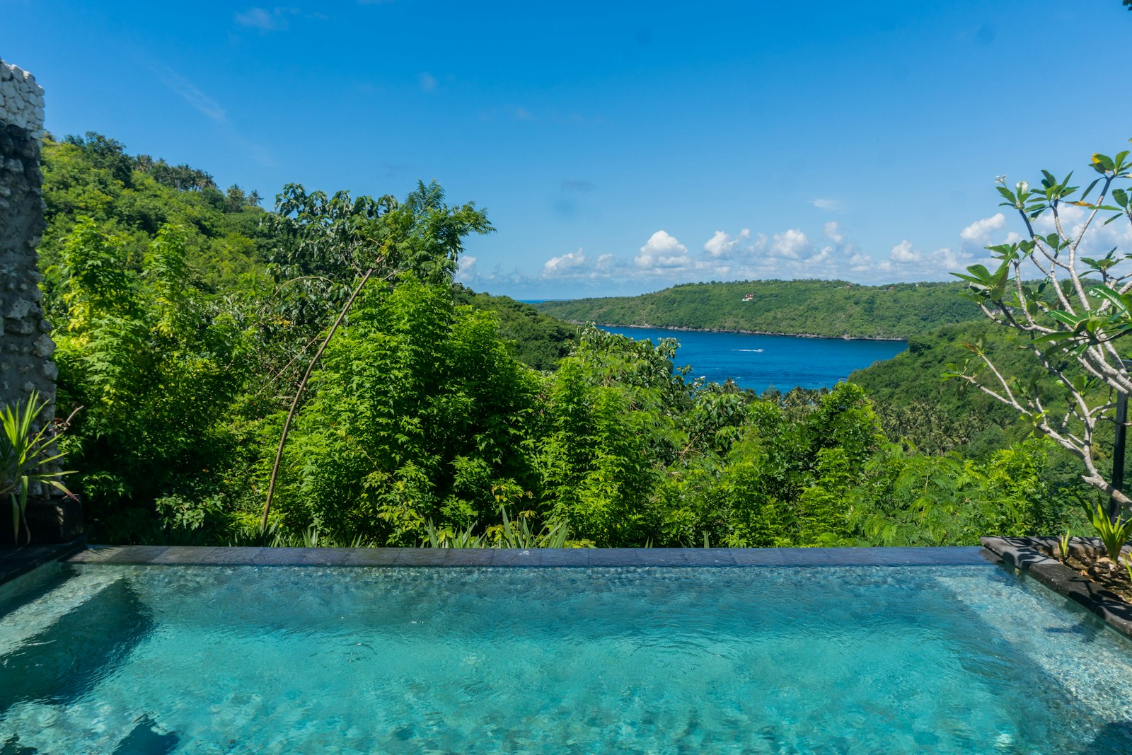 A swimming pool with a view of a lake